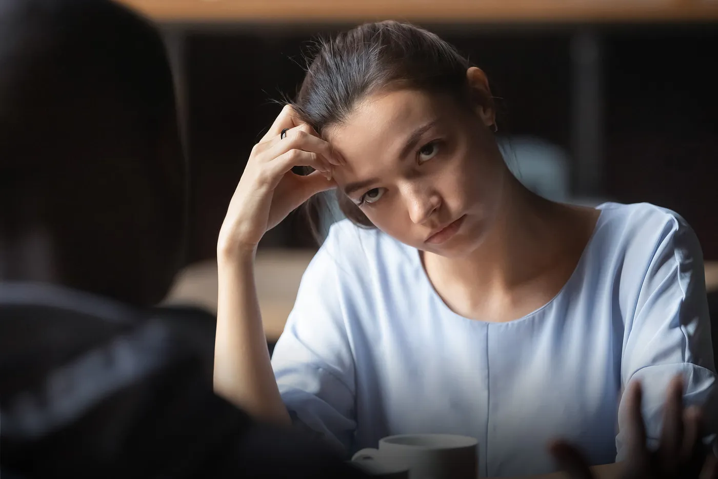 Woman wearing Halo during a tense conversation